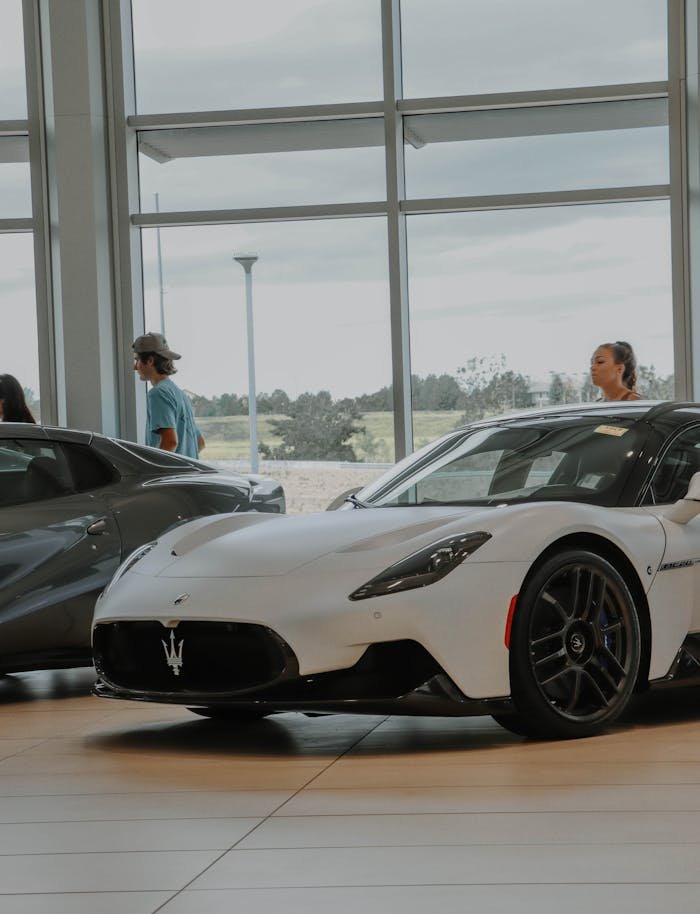 Elegantly displayed Maserati vehicles in a modern car showroom, capturing luxury and style.
